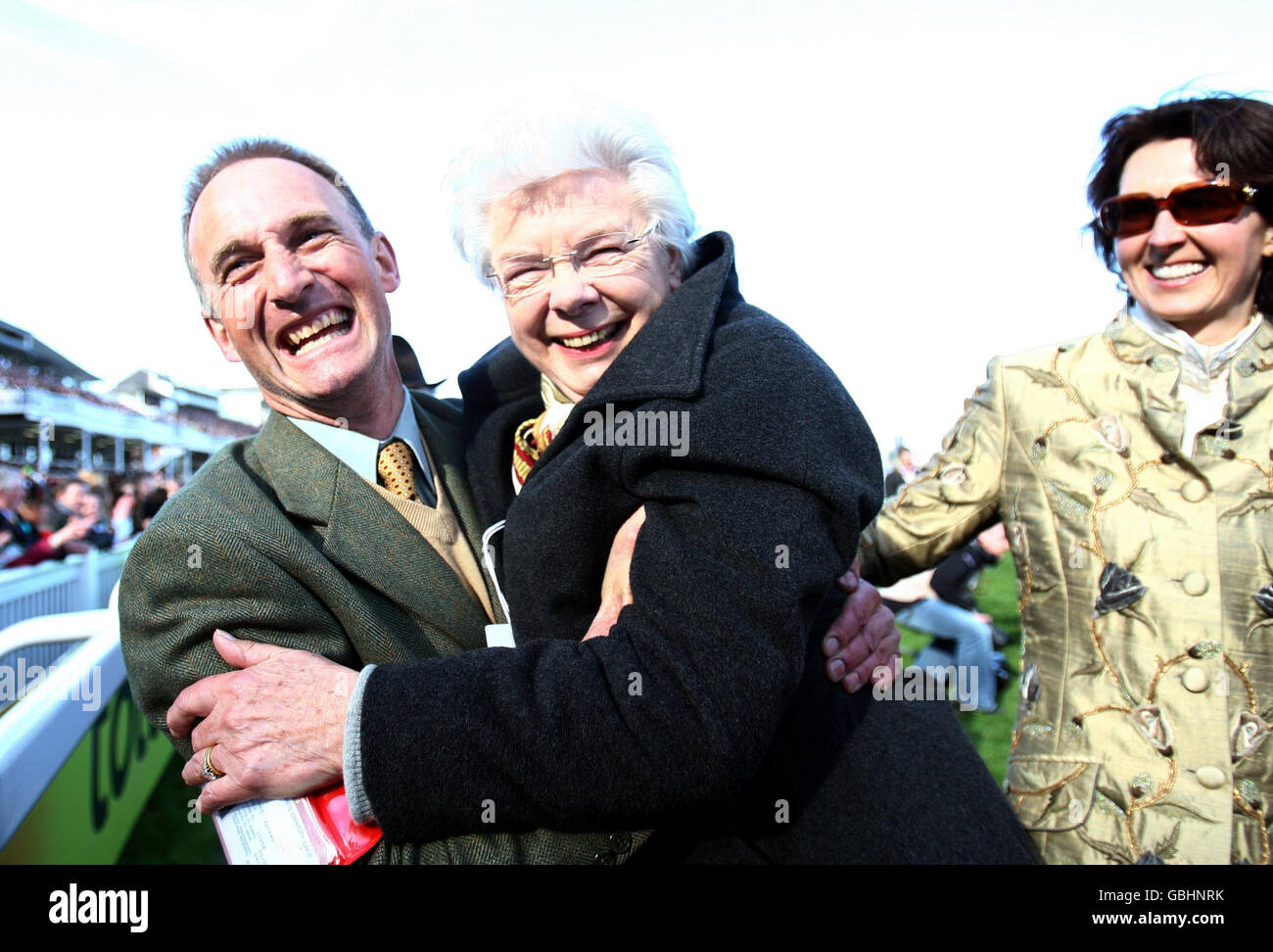 Mon Mome owner Mrs Vida Bingham (centre) celebrates her victory in the John Smith's Grand National during the third day of the John Smith's Grand National meeting at Aintree Racecourse, Liverpool. Stock Photo