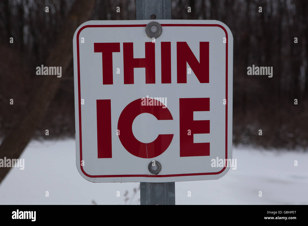 Sign Warning Thin Ice Stock Photo