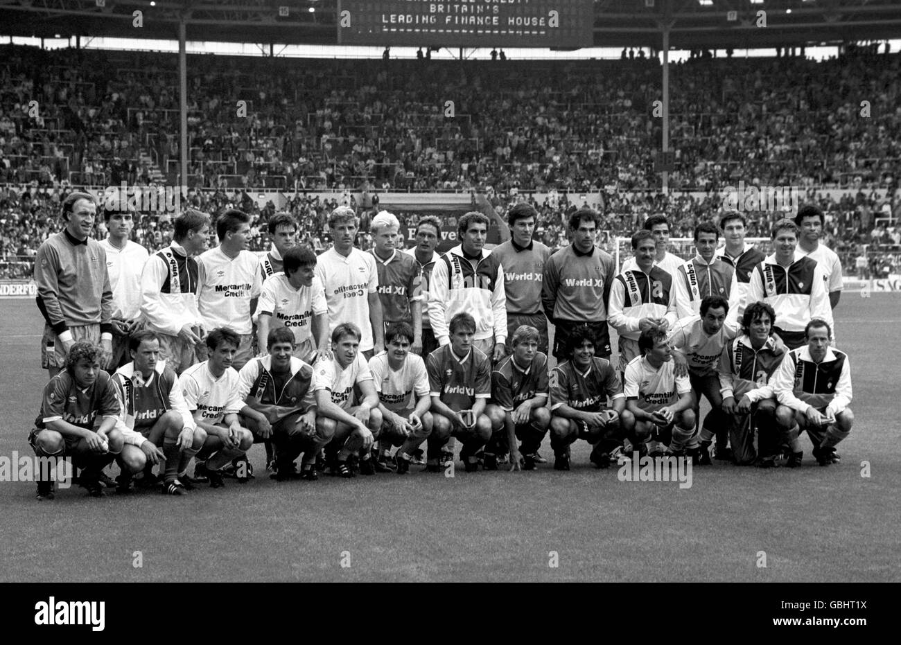 The two sides pose for a team photo before the kick off. (back row l-r) Steve Ogrizovic, Alan Smith, Richard Gough, Chris Waddle, Celso Ayala, Peter Beardsley, Glenn Hysen, tbc, Preben Elkjaer (Denmark), Peter Shilton, Rinat Dasayev (Russia), Andoni Zubizarreta (Spain), Kenny Sansom, Neil Webb, Julio Alberto, Norman Whiteside, Clive Allen and Paul McGrath. (front row l-r) tbc, Igor Belanov, Pat Nevin, Gary Lineker, John McClelland, Steve Clarke, Dragan Stojkovic, Lajos Detari, Diego Maradona (Argentina), Bryan Robson, Ossie Ardiles (Argentina), Paulo Futre, Liam Brady Stock Photo