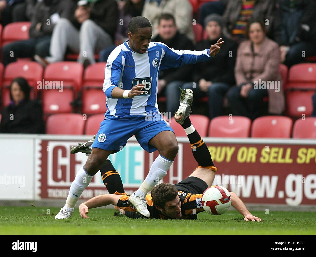 Hull City's Samuel Ricketts and Wigan Athletic's Charles N'Zogbia (left) battle for the ball Stock Photo