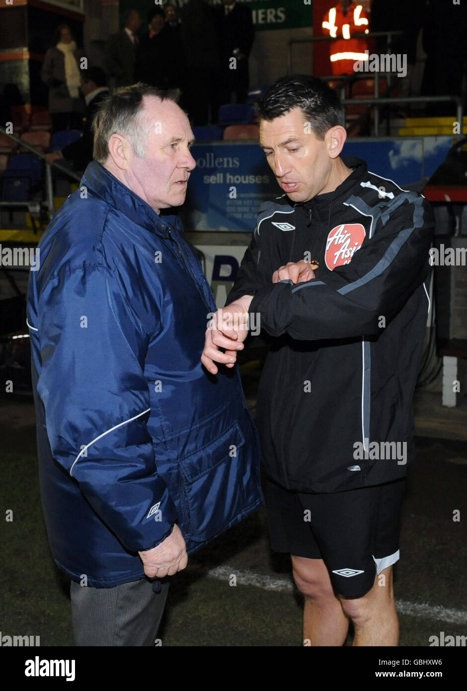 Match referee Lee Probert checks his watch before the Coca-Cola League ...