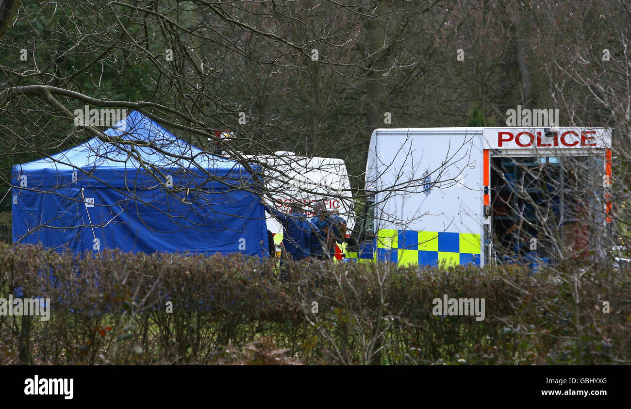 Police exhume unidentified body Stock Photo - Alamy