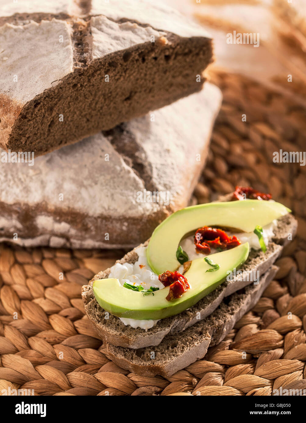 Rye bread with avocado and cheese Stock Photo Alamy