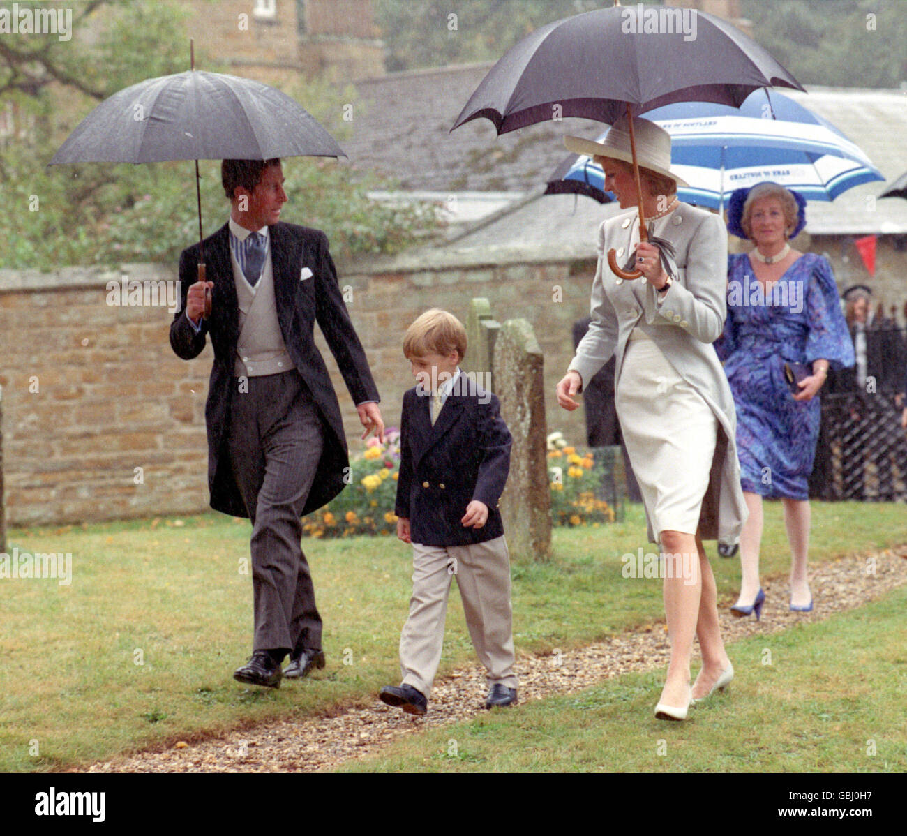 L-R: Prince Charles, Prince William, Princess Diana and her Mother Frances Shand Kydd [right] arrive at St Mary the Virgin Church at Great Brington, Northamptonshire for the wedding of the Princess' Brother Viscount Althorp Stock Photo