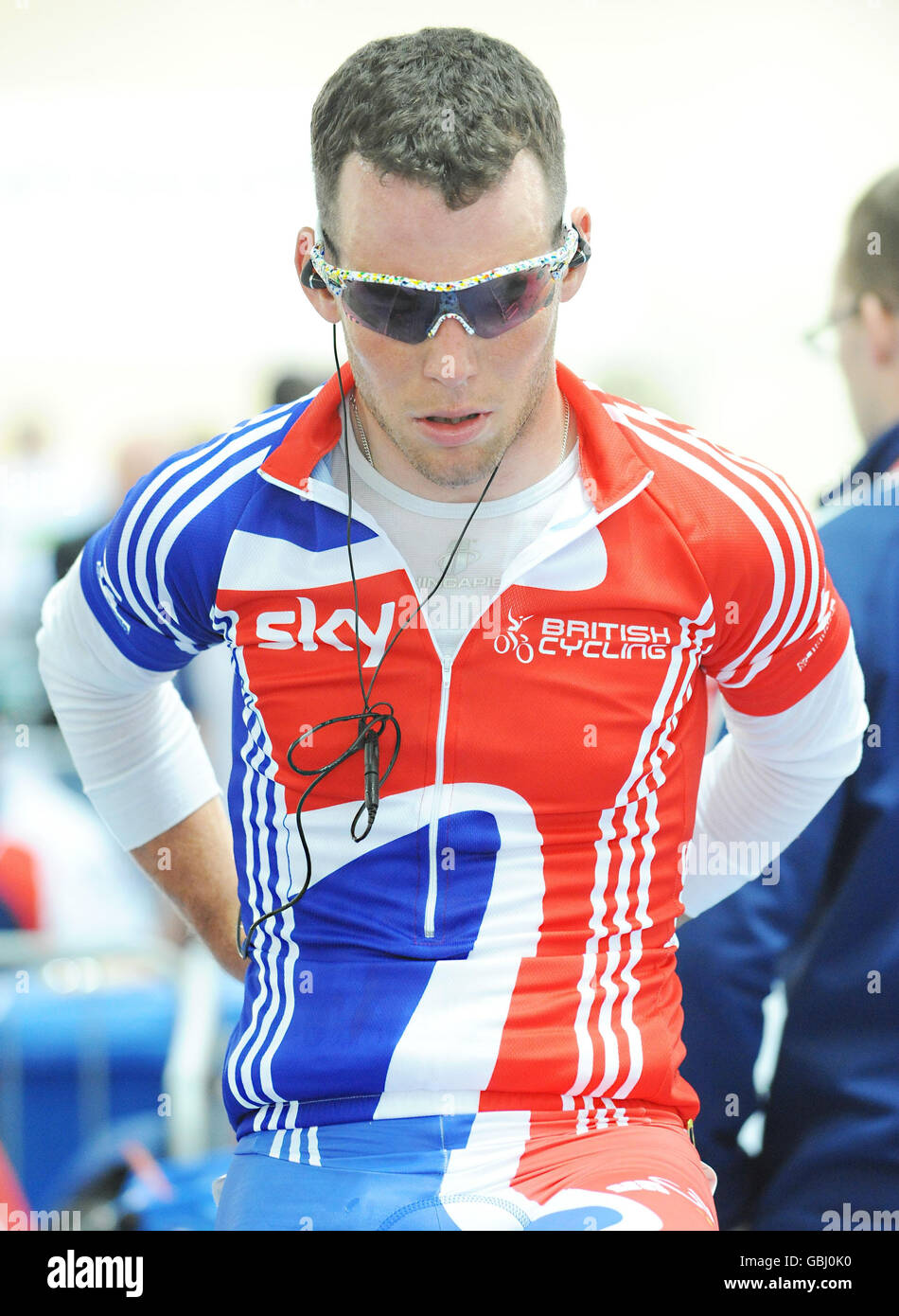 Great Britain's Mark Cavendish listens to his headphones on the rollers