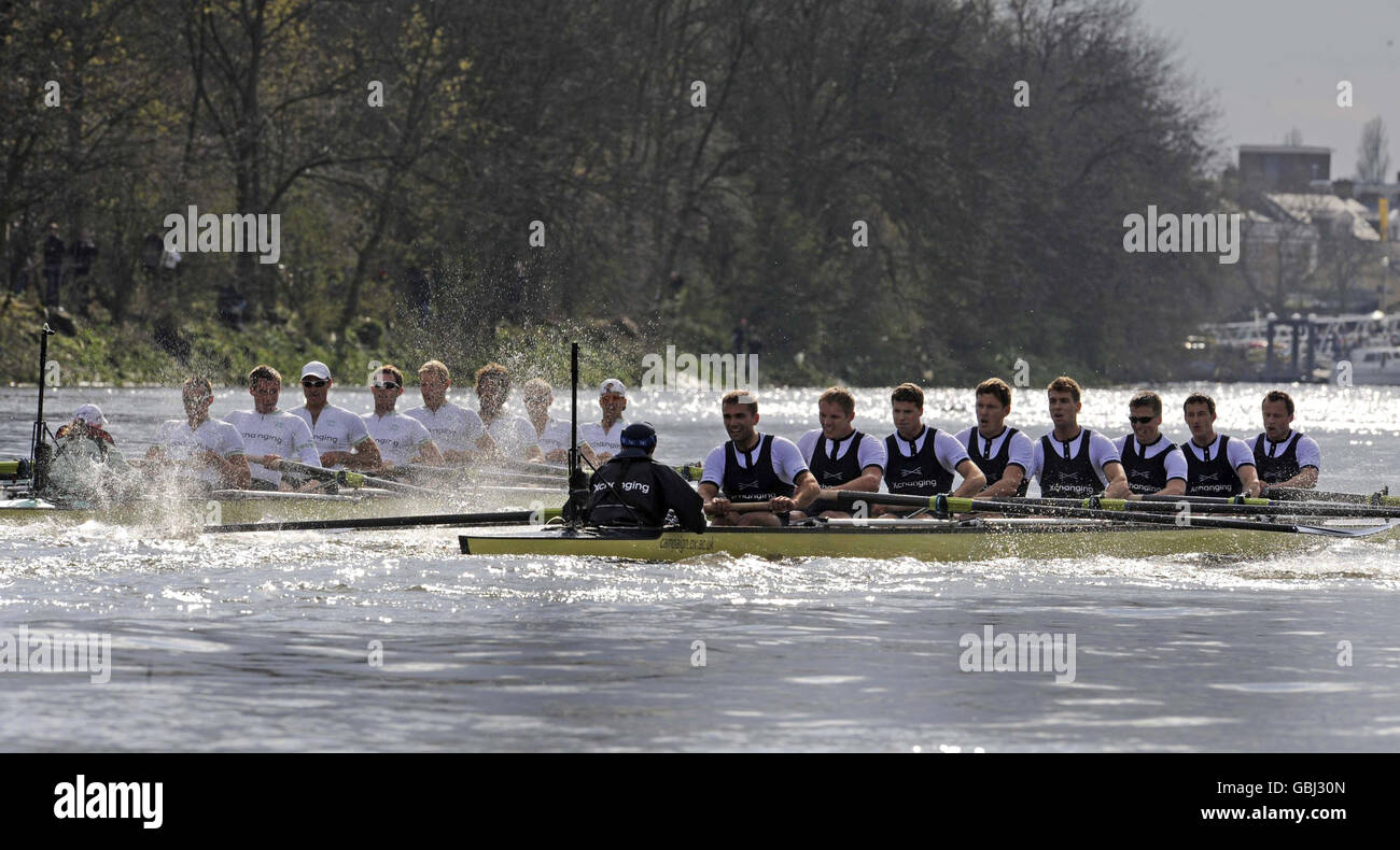The Oxford crew (right) reach the finish line to claim their victory ahead of Cambridge in the