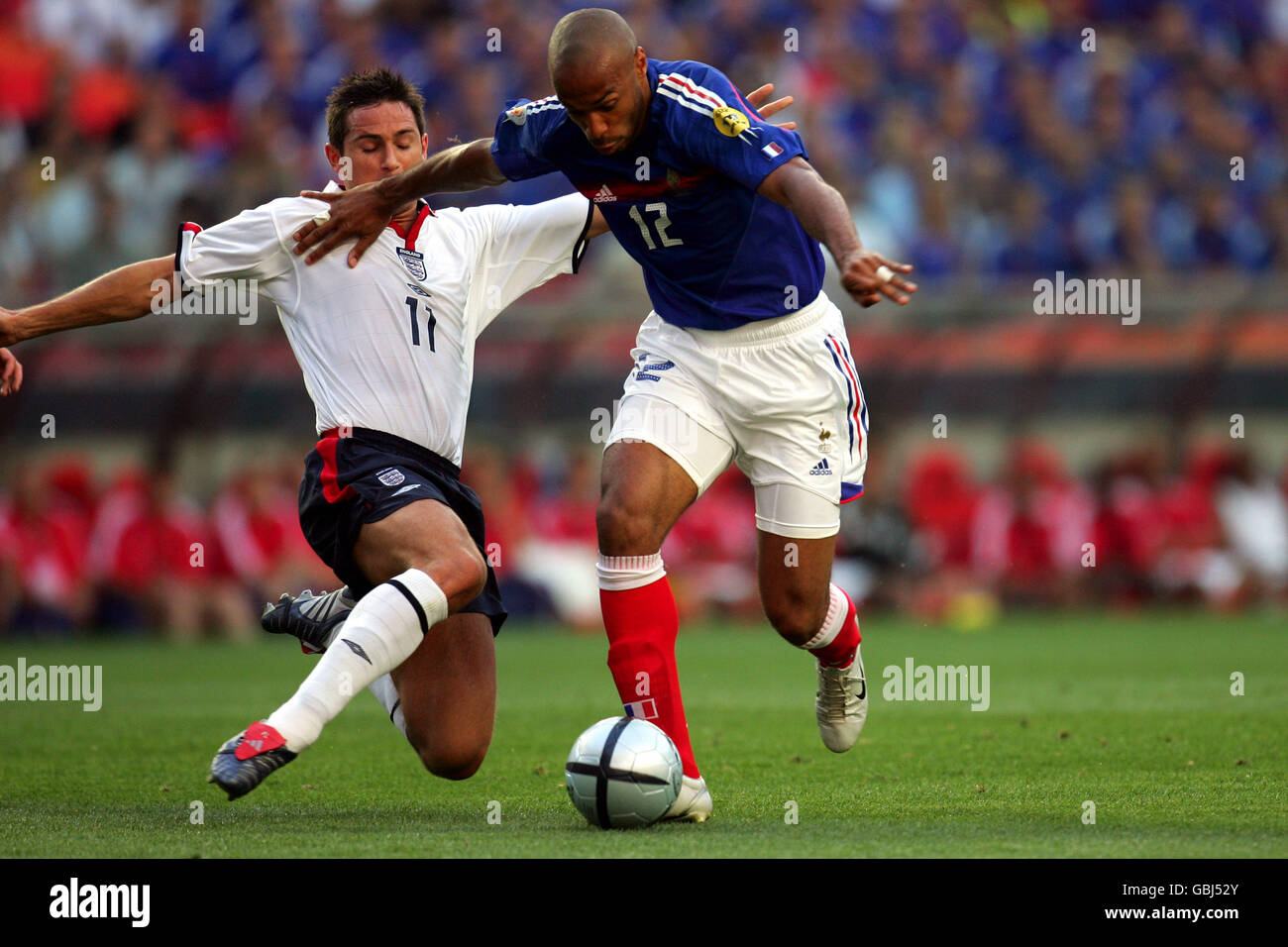 Soccer - UEFA European Championship 2004 - Group B - France v England. France's Thierry Henry and England's Frank Lampard battle for the ball Stock Photo