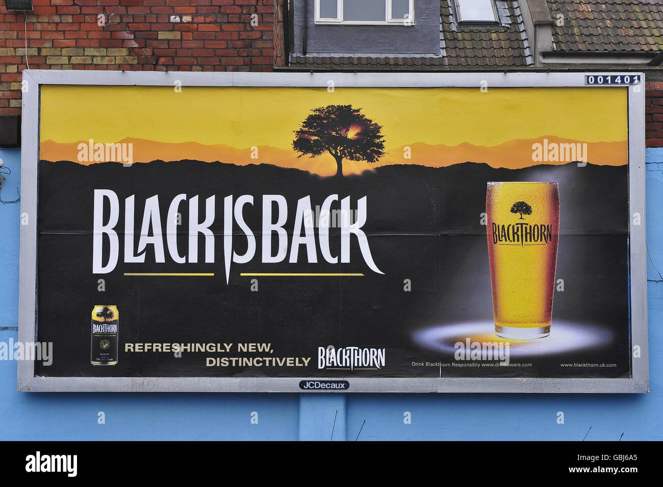 An undefaced poster for Blackthorn cider in a car garage on West Street, Bedminster, Bristol, where at least two posters have been defaced in the area. Stock Photo