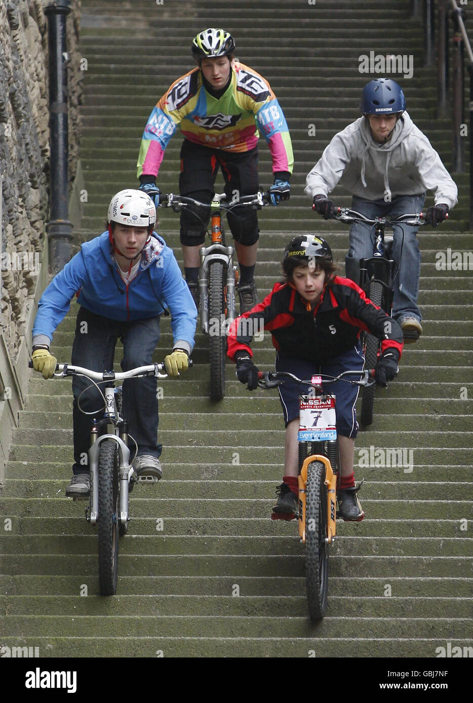 Competitors ride their bikes down Warriston Close Steps in Edinburgh to promote the Edinburgh Rat Race. Stock Photo