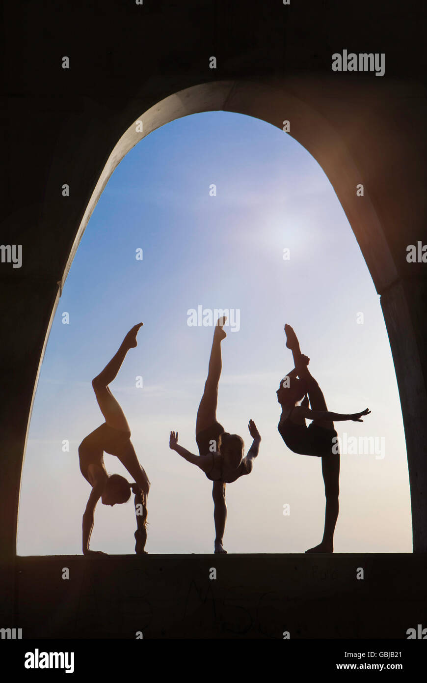 gymnasts outdoor silhouette Stock Photo