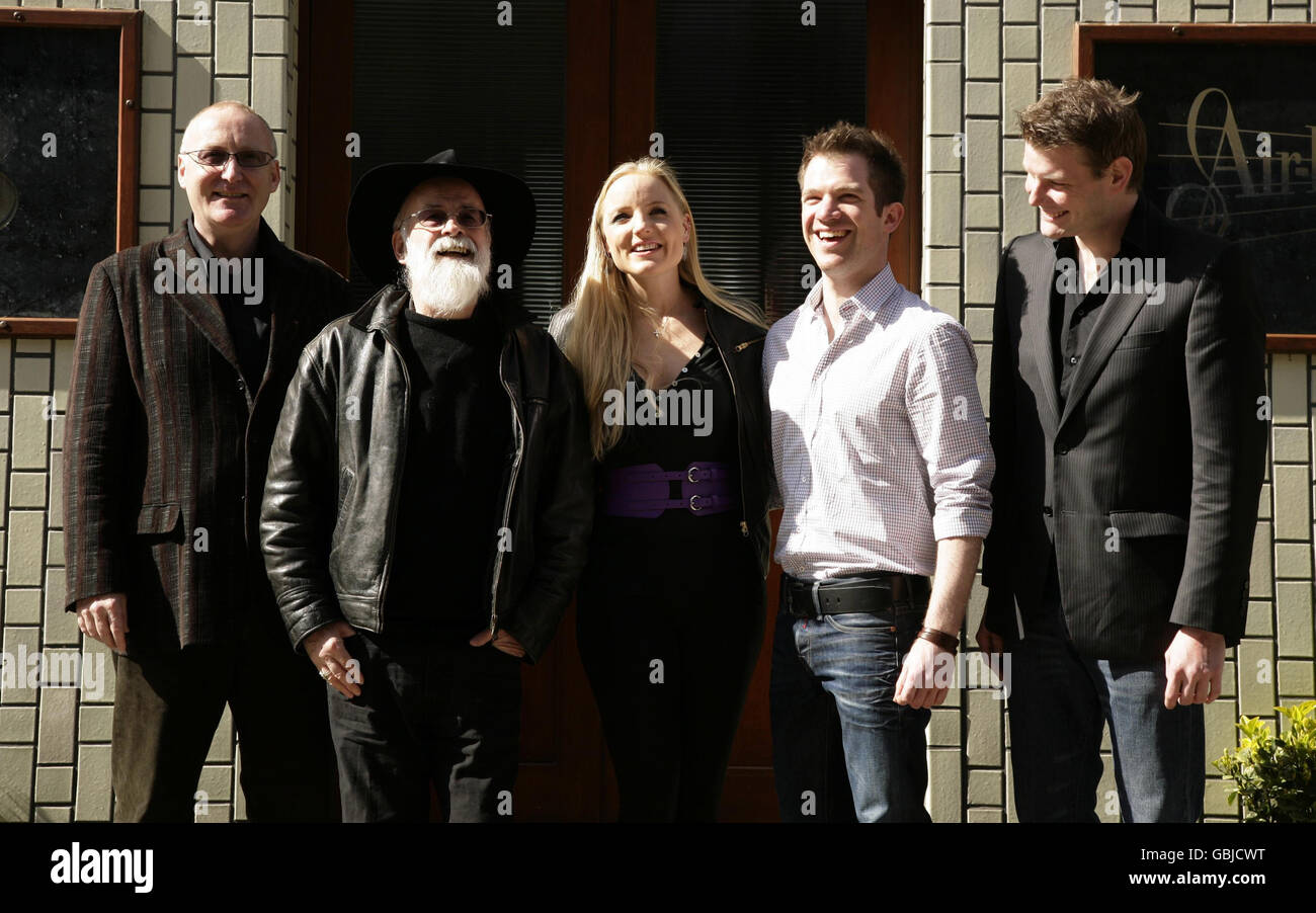 Author Terry Pratchett (2nd L) with Shaun McKenna (L, lyrics), West End actors Kerry Ellis and Daniel Boys (2nd R), and Leighton James House (music), during a photocall to annouce the recording of an album of songs from the sci-fi musical 'Only You Can Save Mankind', based on the book by Pratchett and involving major West End singers, at Air Edel Studios in central London. Stock Photo