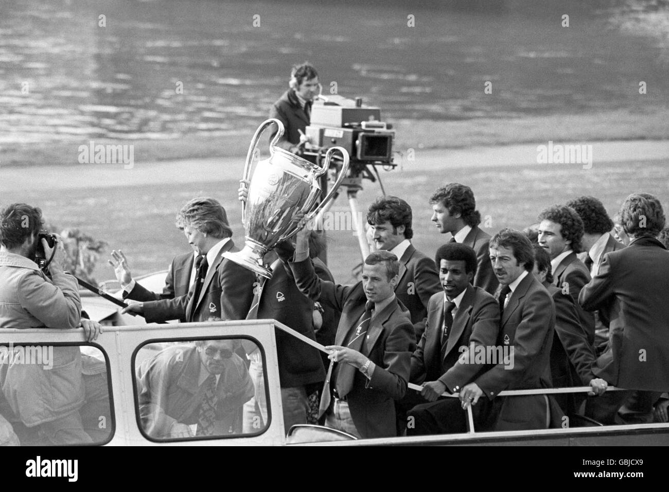 Nottingham Forest captain John McGovern and his team hold the European Cup aloft as they tour Nottingham in the traditional open top bus for their civic reception. Stock Photo