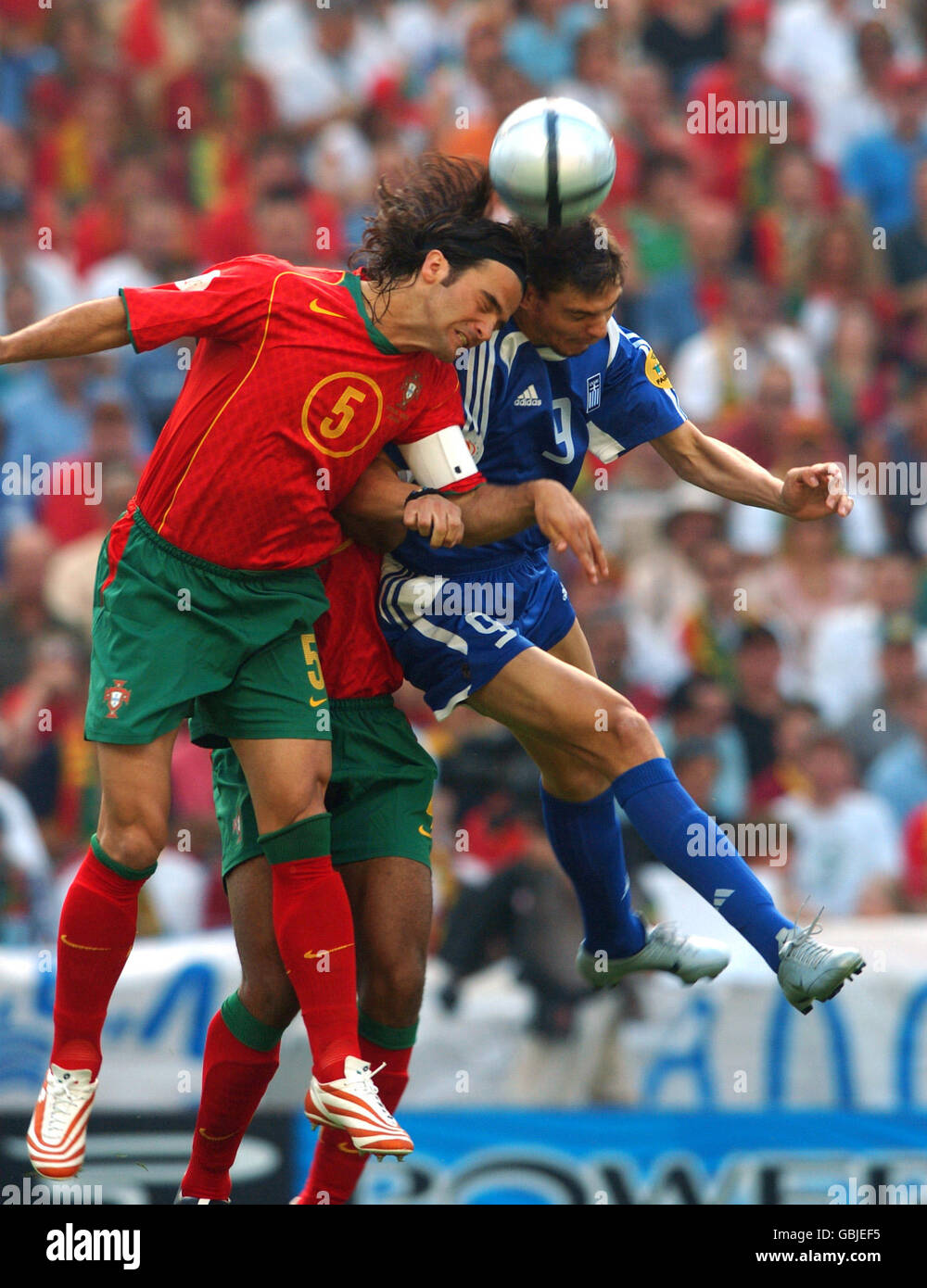 Portugals fernando couto greeces angelos charisteas battle for the ball ...