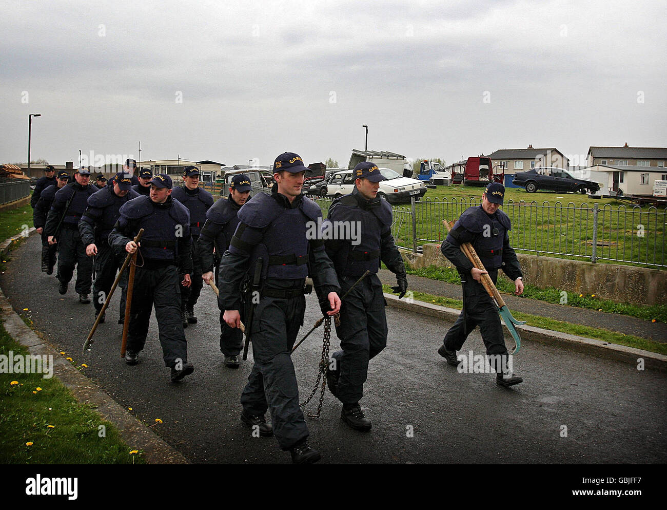 Gardai after seizing implements when searching the Oldcastle Travellers Halting site in Clondalkin, Dublin after violence flared there earlier this afternoon. Stock Photo