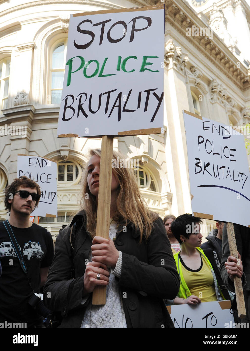 Demonstrators gather at the Bank of England, London ahead of a march to Bethnal Green, east London to protest against the policing of last Wednesday's G20 marches in London. Stock Photo