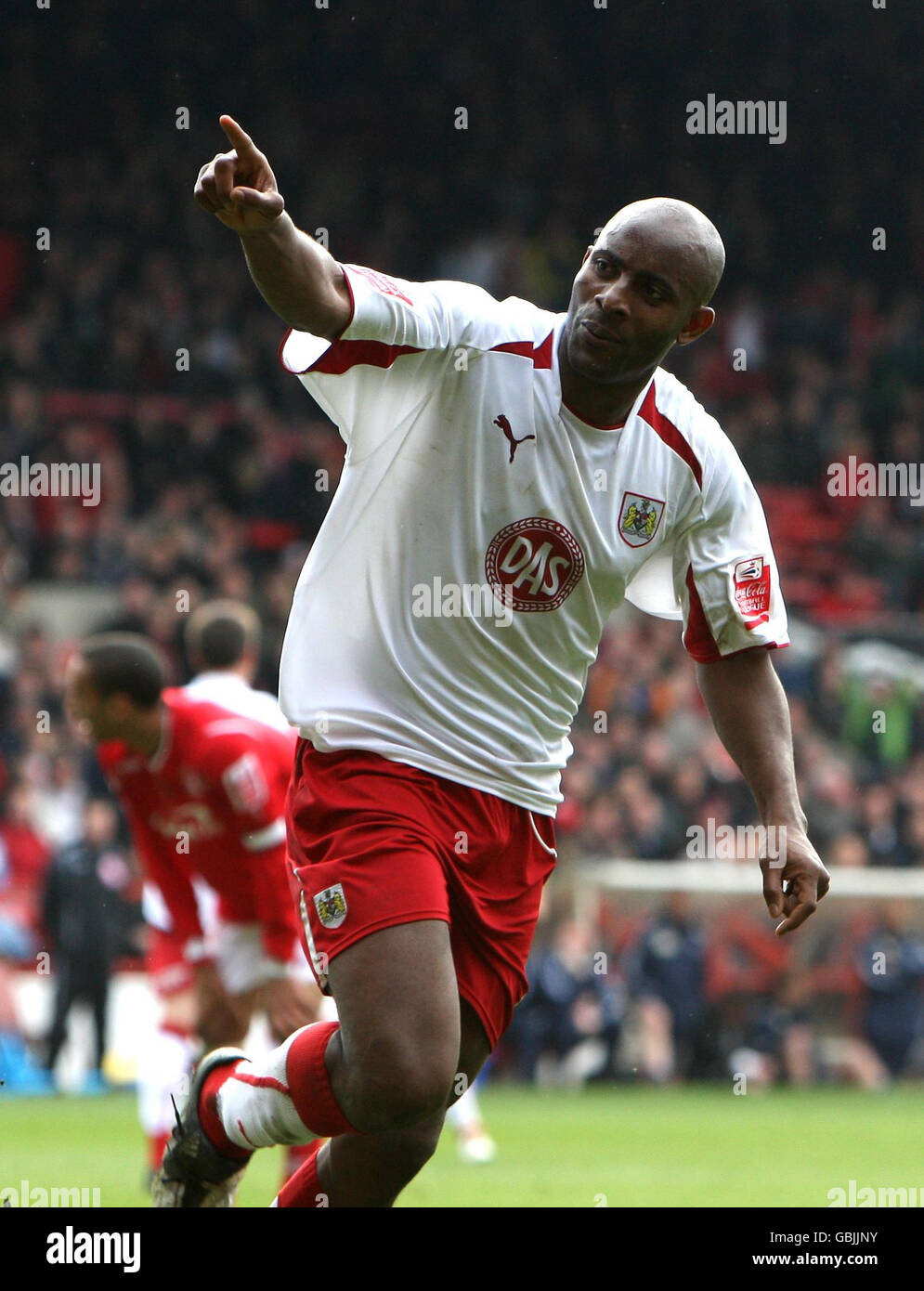 Bristol City's Dele Adebola celebrates scoring their second goal of the game during the Coca-Cola Football League Championship match at the City Ground, Nottingham. Stock Photo