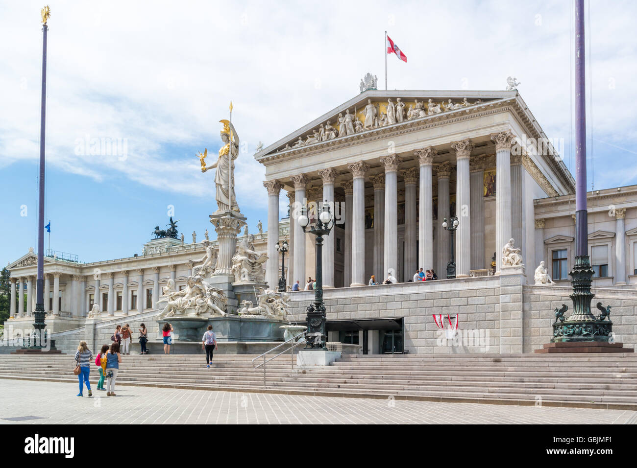 People in front of Austrian parliament building on Ringstrasse in