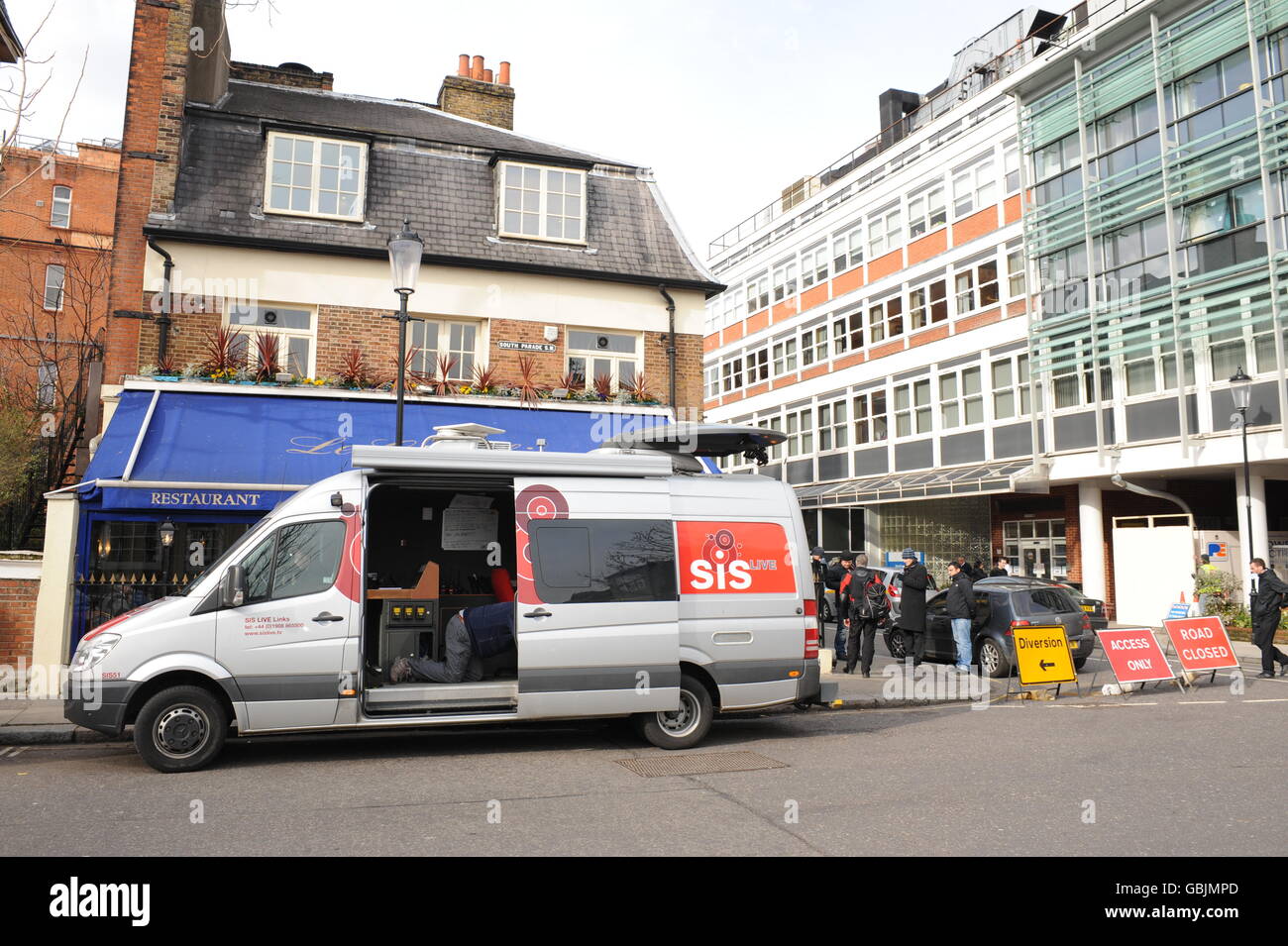 An SIS van parked outside Le Colombier Restaurant and The Royal Marsden Hospital, on Dovehouse Street, Kensington, London. Stock Photo