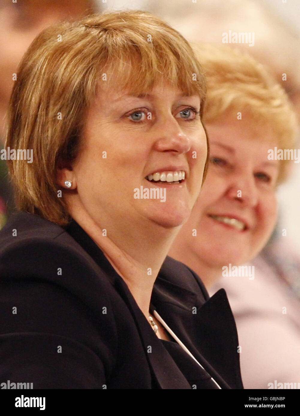 Home Secretary Jacqui Smith listens to a speech by Prime Minister Gordon Brown at the SECC in