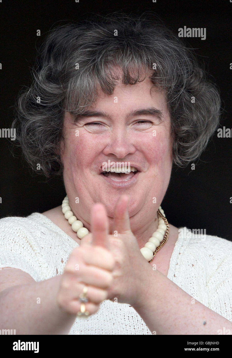 Britains Got Talent star Susan Boyle. Britains Got Talent star Susan Boyle gives a thumbs up at her front door in Blackburn,West Lothian. Stock Photo