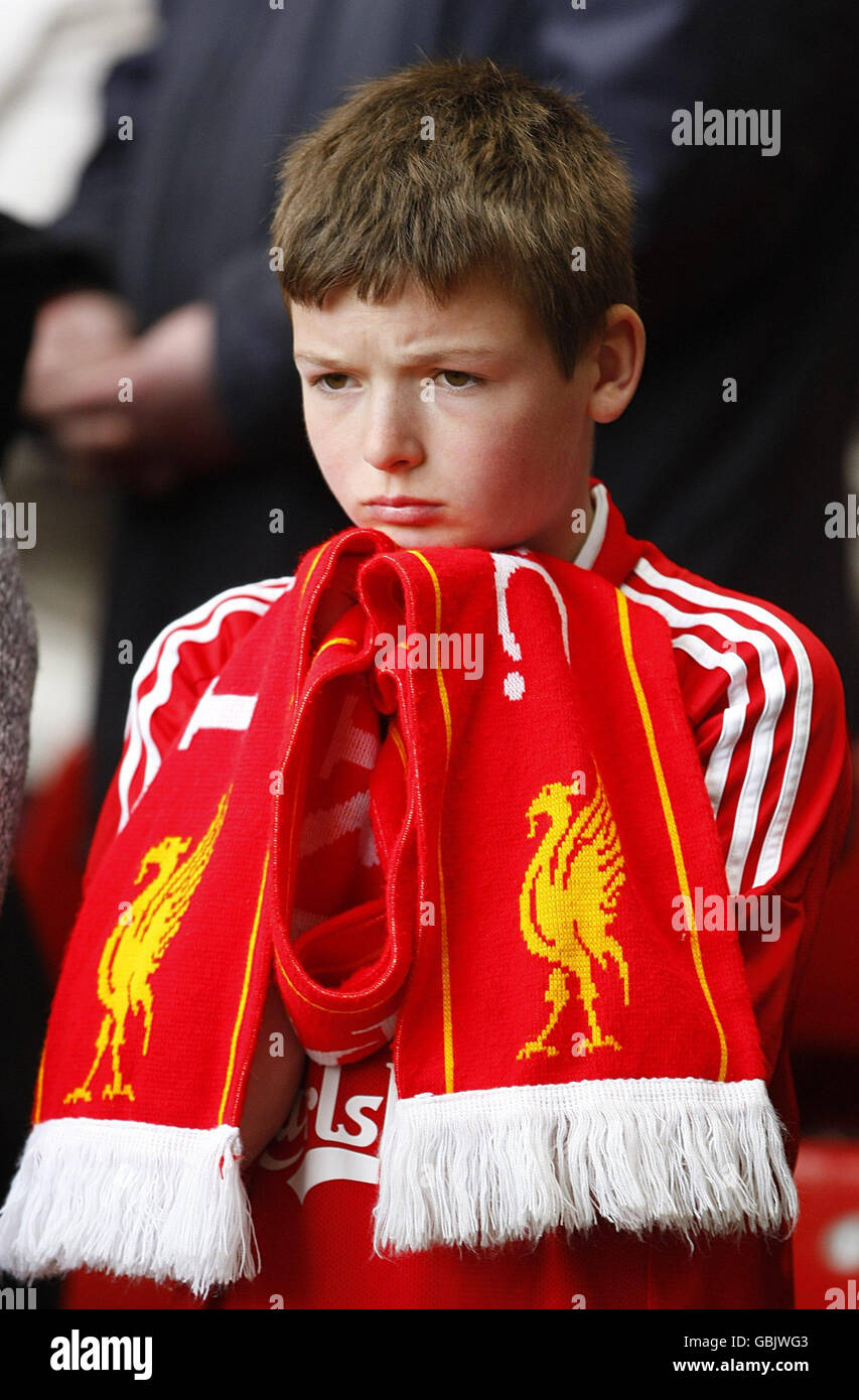 A young Liverpool fan at the official memorial service at Liverpool's