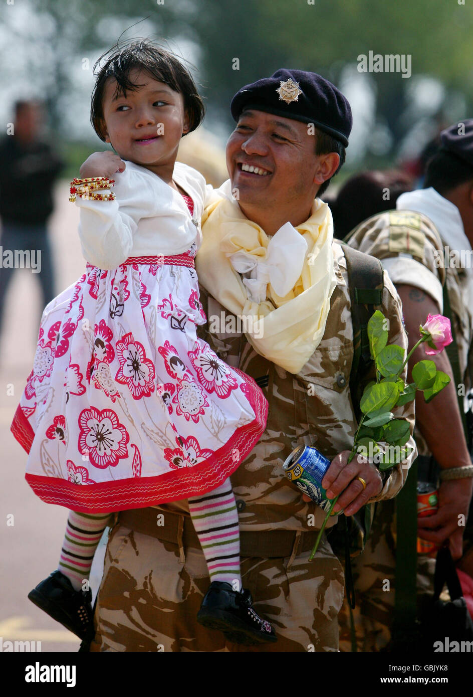 Sgt. Milan Gurung with his daughter Muskqan, as around 120 members of 2nd Battalion the Royal Gurkha Rifles arrive back at their barracks in Folkestone, Kent, after returning from Helmand Province in Afghanistan. Stock Photo