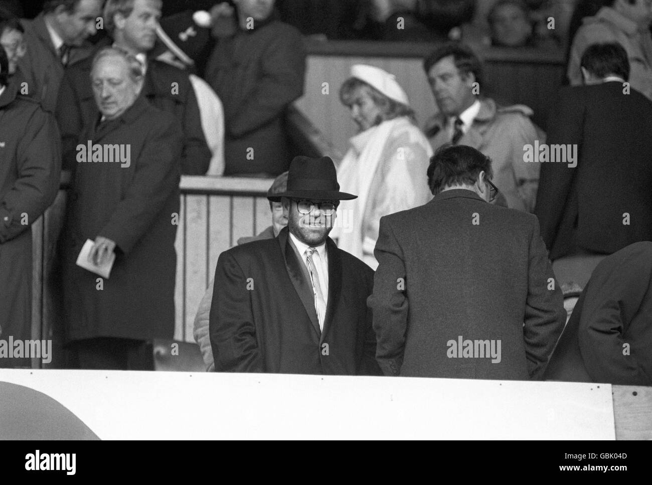 Soccer - FA Cup - Semi Final - Tottenham Hotspur v Watford - White Hart Lane. Pop singer and Watford Chairman, Elton John, watching his team. Stock Photo