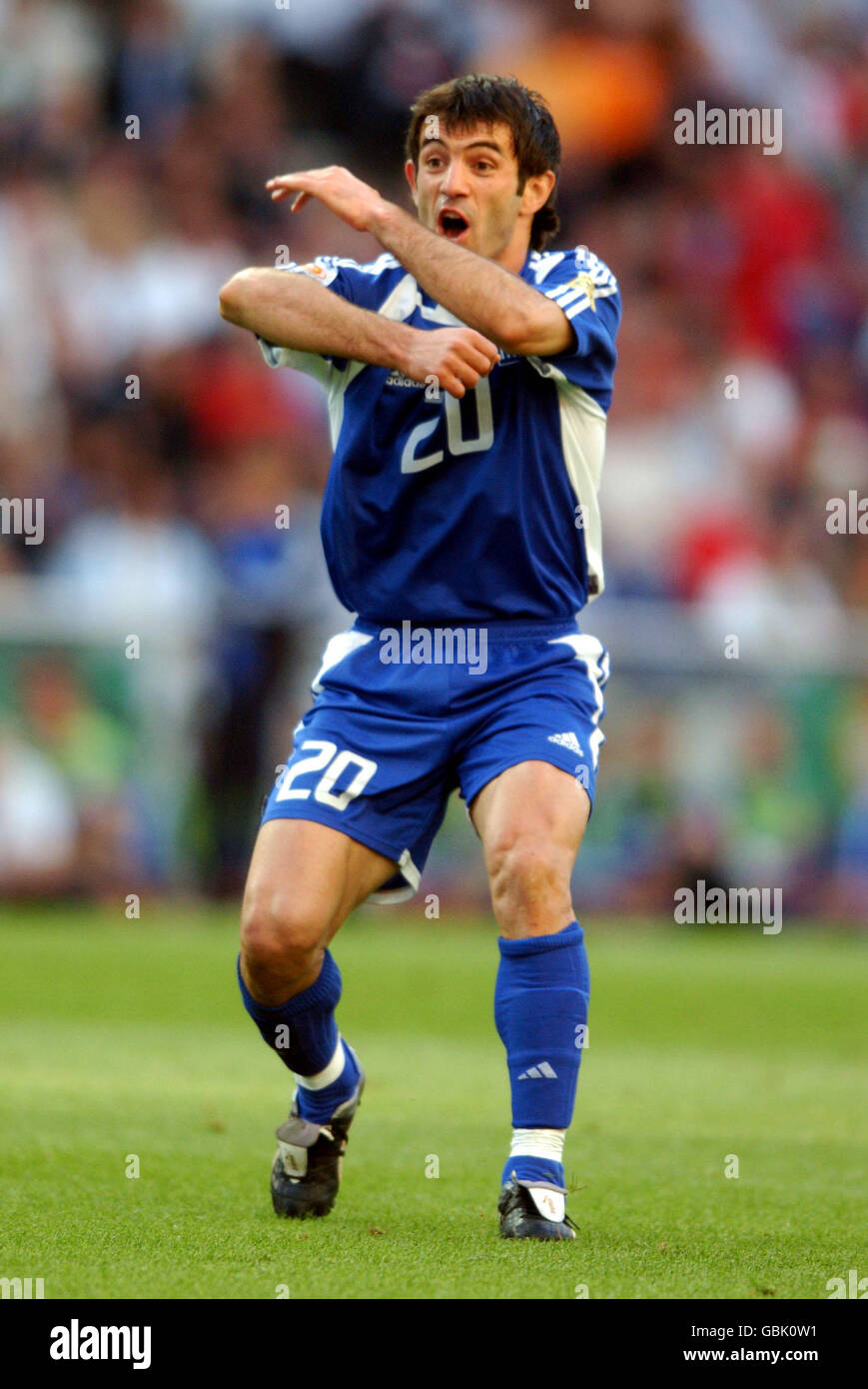 Greece's Georgios Karagounis appeals against a yellow card as he misses the final Stock Photo
