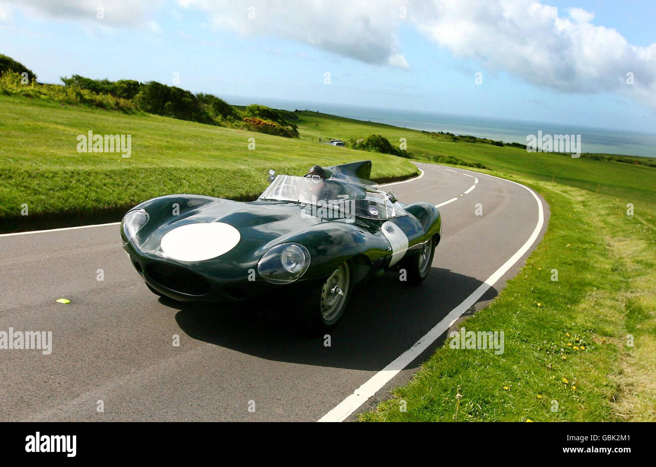 A rare Jaguar D-type, one raced by motor racing legend Mike Hawthorn takes a special test drive near Eastbourne in Sussex, to mark the opening of a private museum dedicated to the famous driver who died 50 years ago. Stock Photo