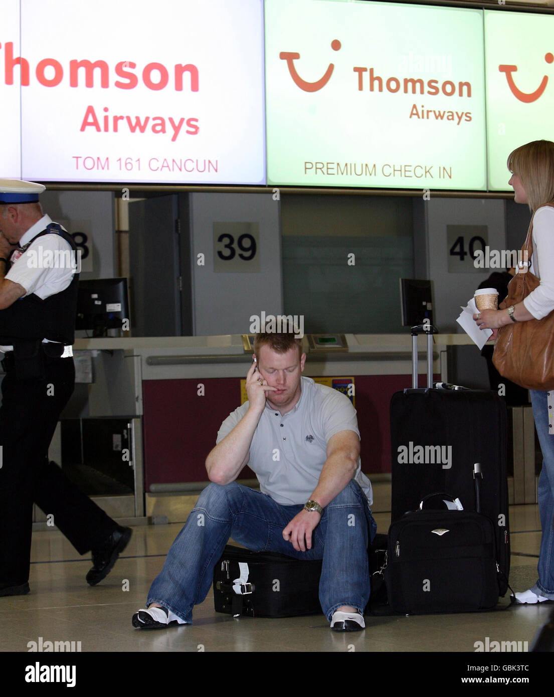 At manchester airports terminal two after the flight to cancun hires