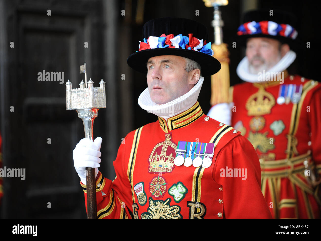 Yeoman Warders stand at the entrance to Westminster Abbey awaiting the arrival of The Queen for a service to commemorate the 500th anniversary of the Founder of the Queen's Body Guard of the Yeoman of the Guard. Stock Photo
