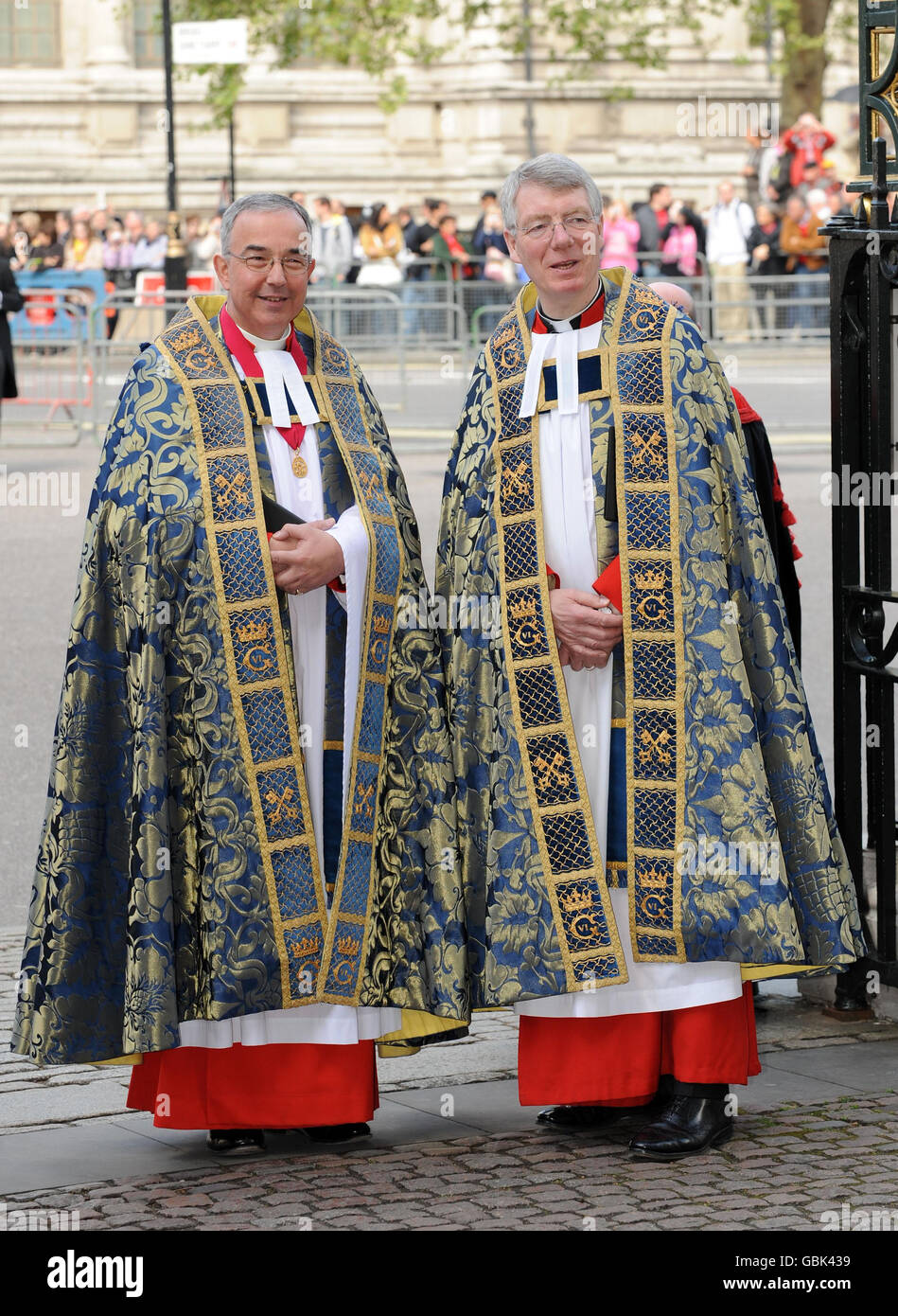 The Dean of Westminster the Very Rev Dr John Hall, left, and Sub Dean Rev Robert Wright await the arrival of The Queen at Westminster Abbey for a service to commemorate the 500th anniversary of the Founder of the Queen's Body Guard of the Yeoman of the Guard. Stock Photo