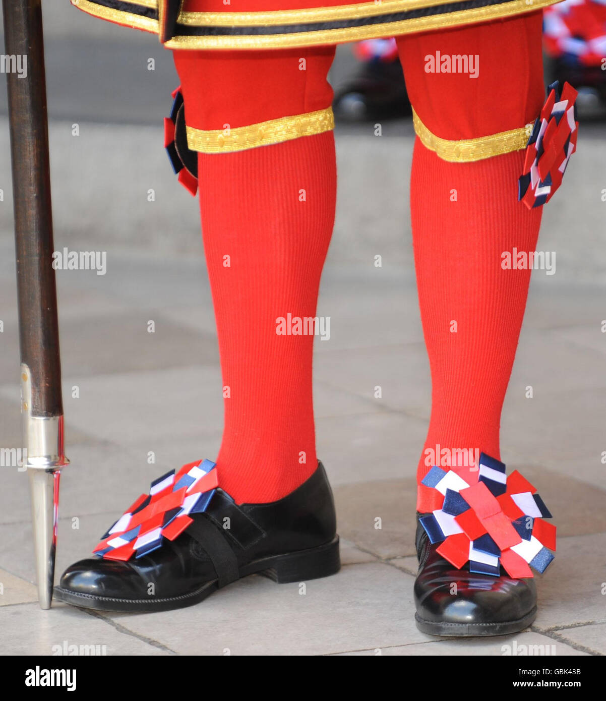 A Yeoman Warder stands at the entrance to Westminster Abbey awaiting the arrival of The Queen for a service to commemorate the 500th anniversary of the Founder of the Queen's Body Guard of the Yeoman of the Guard. Stock Photo