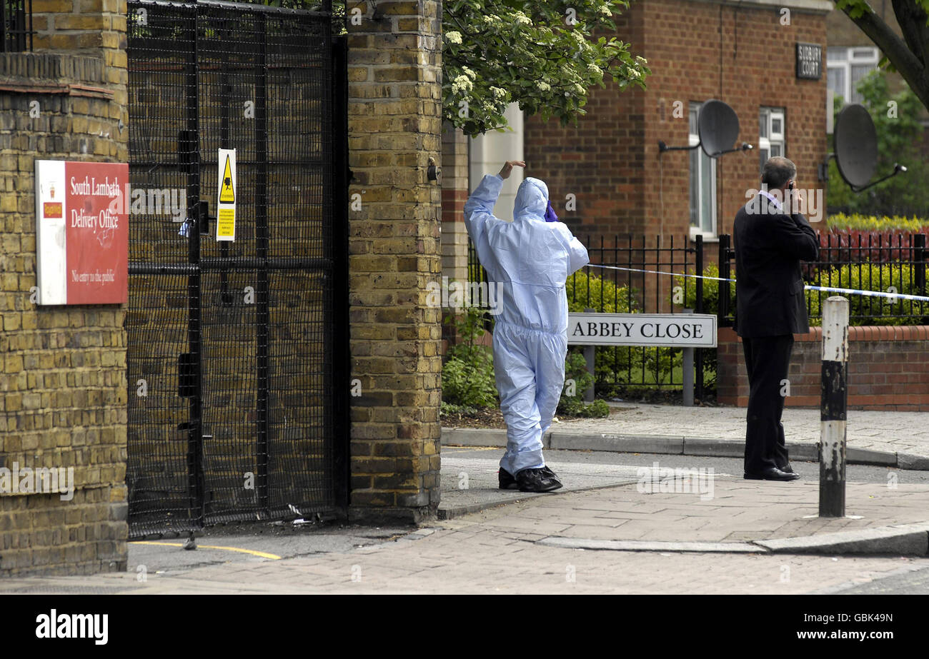Forensic police officers on the corner of Abbey Close and Lansdowne Way, near to Larkhall Park in south London, where two teenagers were stabbed last night. Stock Photo