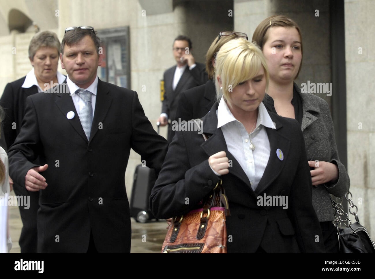 George Kinsella (left), the father of murdered teenager Ben Kinsella and Ben's sister Brooke Kinsella (centre right) leave the Old Bailey in London this afternoon. Stock Photo