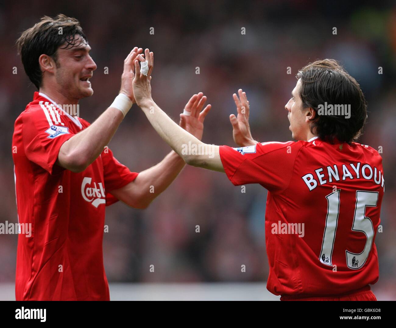 Liverpool's Yossi Benayoun (right) celebrates with team mate Albert Riera after scoring his sides first goal of the game. Stock Photo