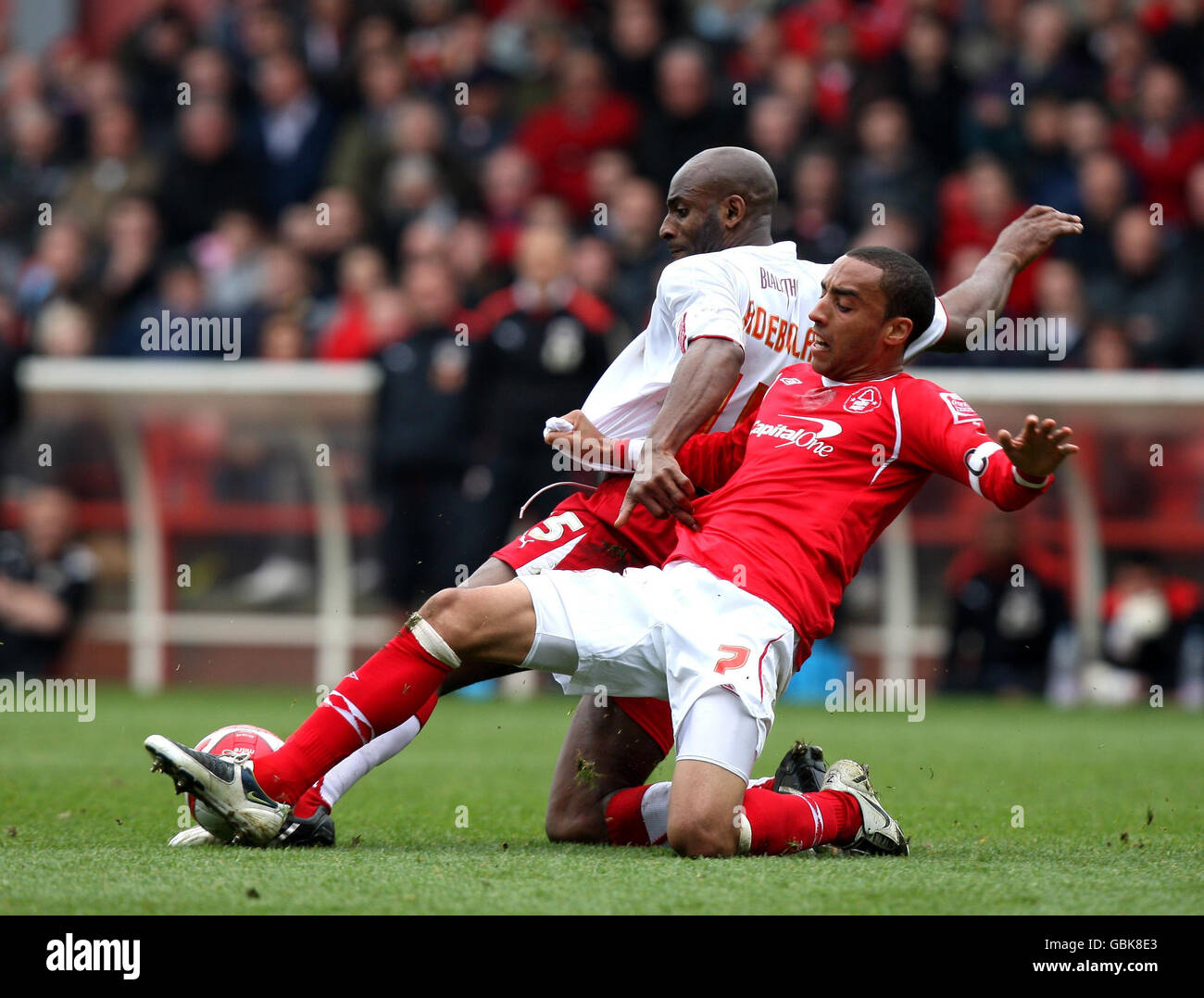 Nottingham Forest's James Perch (front) and Bristol City's Dele Adebola (back) during the Coca-Cola Football League Championship match at the City Ground, Nottingham. Stock Photo