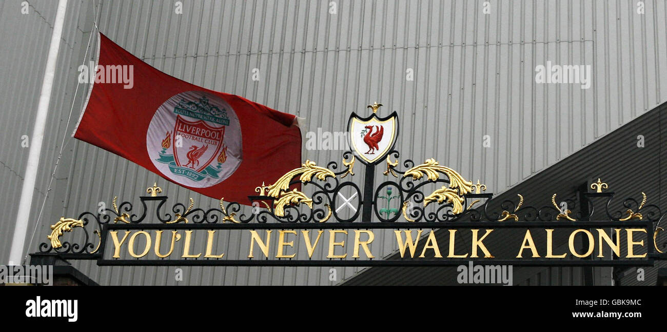 The Liverpool flag flies at half-mast outside the Shankly Gates next to the Hillsborough Memorial. Stock Photo