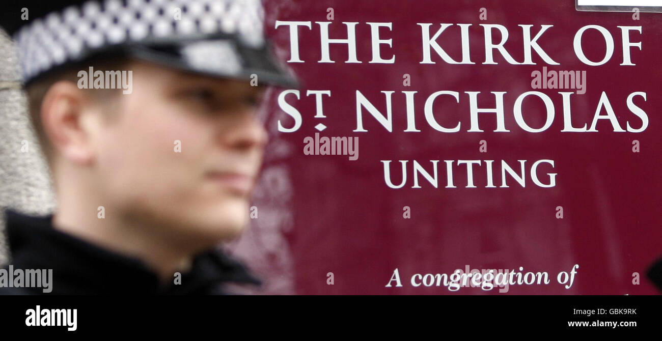 A police officer at the Kirk of St Nicholas Uniting in Aberdeen ahead of a memorial service for sixteen men who died when their helicopter crashed in the North Sea. Stock Photo