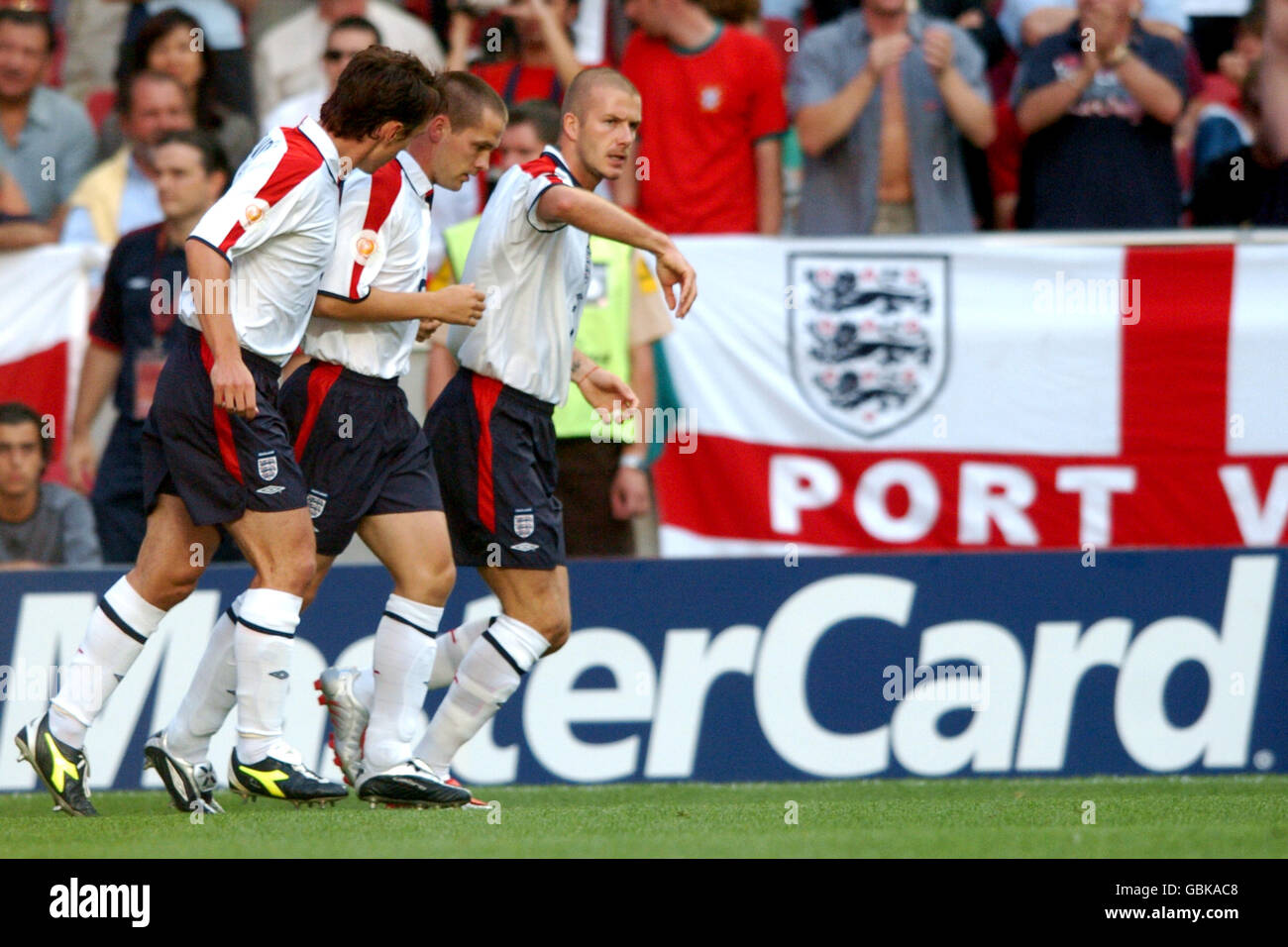 England's David Beckham, Frank Lampard, Wayne Rooney, Paul Scholes and Steven Gerrard congratulate Michael Owen on his opening goal Stock Photo