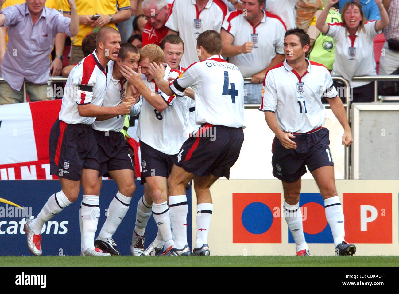 Soccer - UEFA European Championship 2004 - Quarter Final - Portugal v England. England's David Beckham, Frank Lampard, Wayne Rooney, Paul Scholes and Steven Gerrard congratulate Michael Owen on his opening goal Stock Photo