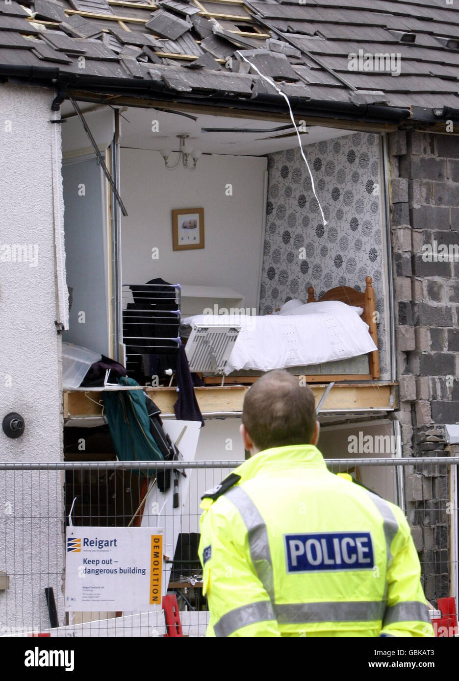 Explosion at house in Renfrew. A police officer views the house in
