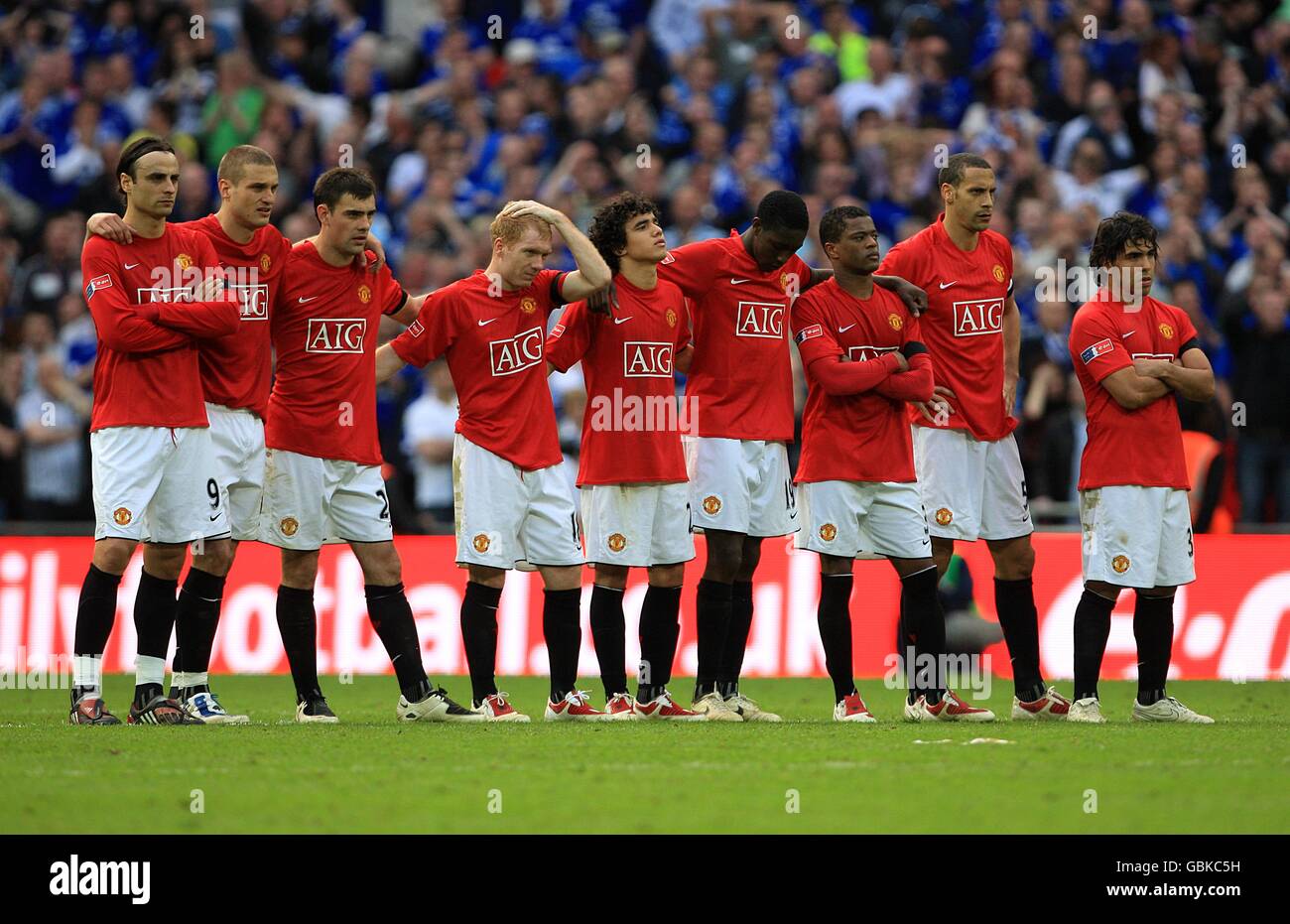 Manchester United watch the penalties from the centre circle Stock