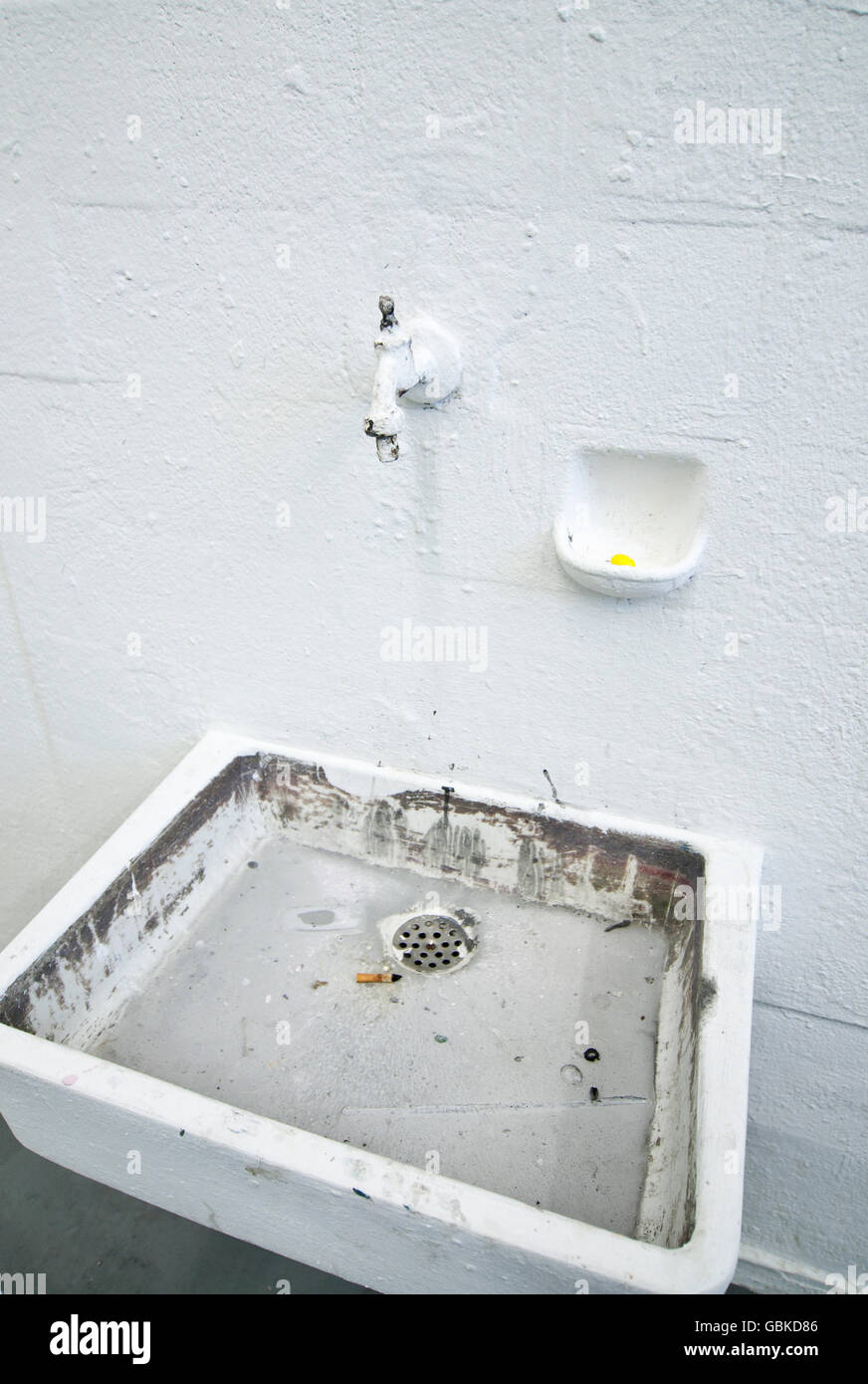 Dirty old sink on whitewashed walls, students' exhibition in the Kunstakademie Duesseldorf Arts Academy Stock Photo