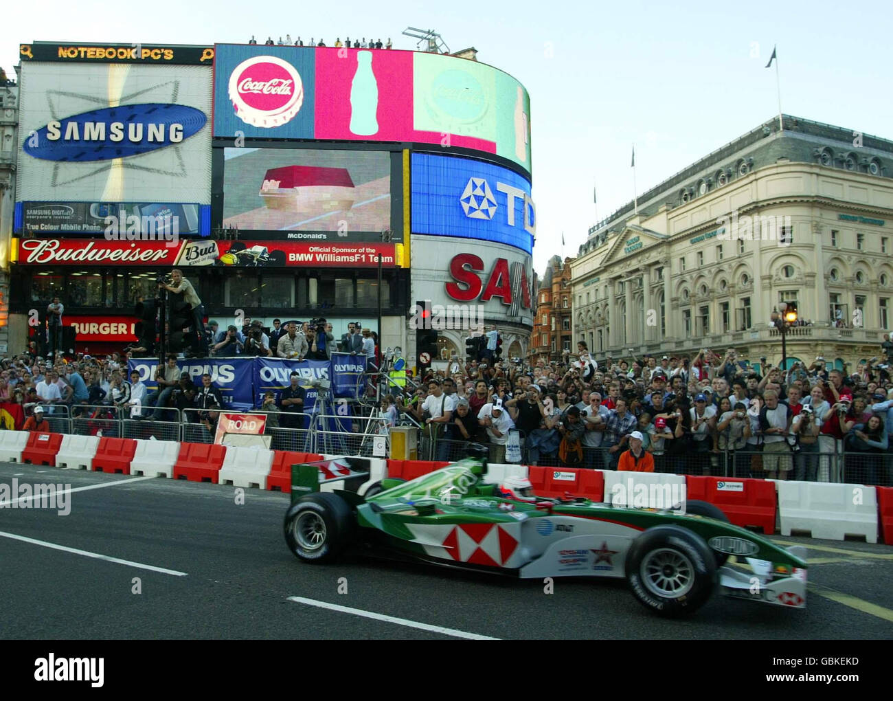 Martin Brundle races along Regent Street, London in a Jaguar car as Formula One comes to the capital. Thousands of Formula One fans gathered for the unprecedented street motor racing event amid calls for a permanent Grand Prix to be staged there. Top drivers old and new arrived for this evening's central London event to see the powerful cars drive along the 3km Regent Street course. British legend Nigel Mansell, Jenson Button and Scot David Coulthard were among the participants from eight Formula One teams including Ferrari and Williams to join a procession along the road. Stock Photo