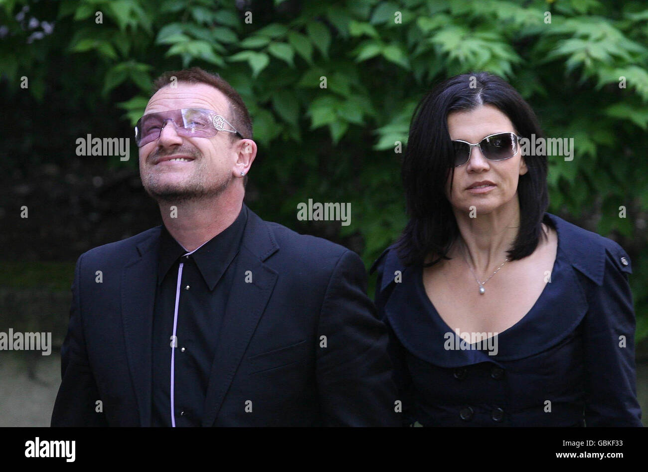 Bono and wife Alison Hewson arrive at St Bride's Church in Fleet Street, London, for the funeral of broadcaster, writer and former Liberal MP, Sir Clement Freud. Stock Photo