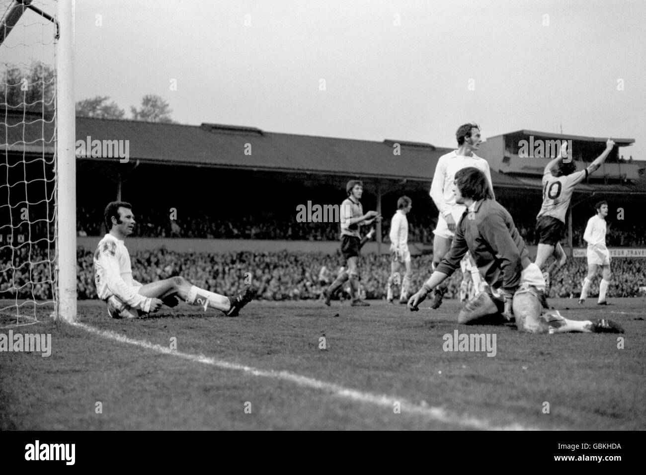 Wolverhampton Wanderers' Derek Dougan (r) celebrates the opening goal, to the dejection of Leeds United's Paul Reaney (l), David Harvey (on knees) and Paul Madeley (c) Stock Photo