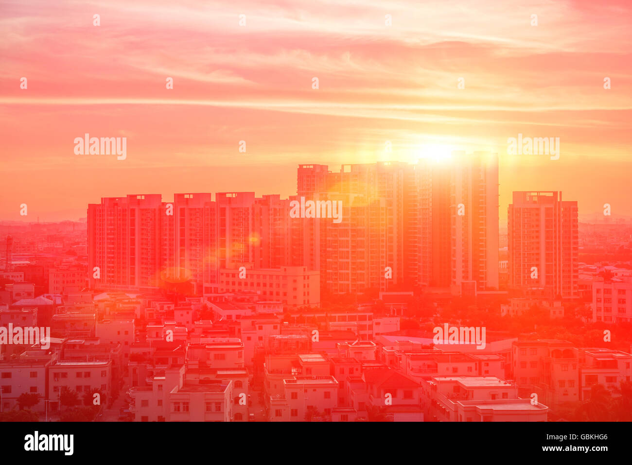 residential building in nightfall against the sun Stock Photo
