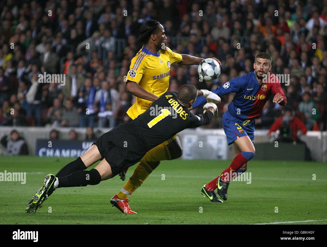 Soccer - UEFA Champions League - Semi Final - First Leg - Barcelona v Chelsea - Nou Camp. Barcelona goalkeeper Victor Valdes (centre) makes a save to block the shot from Chelsea's Didier Drogba. Stock Photo