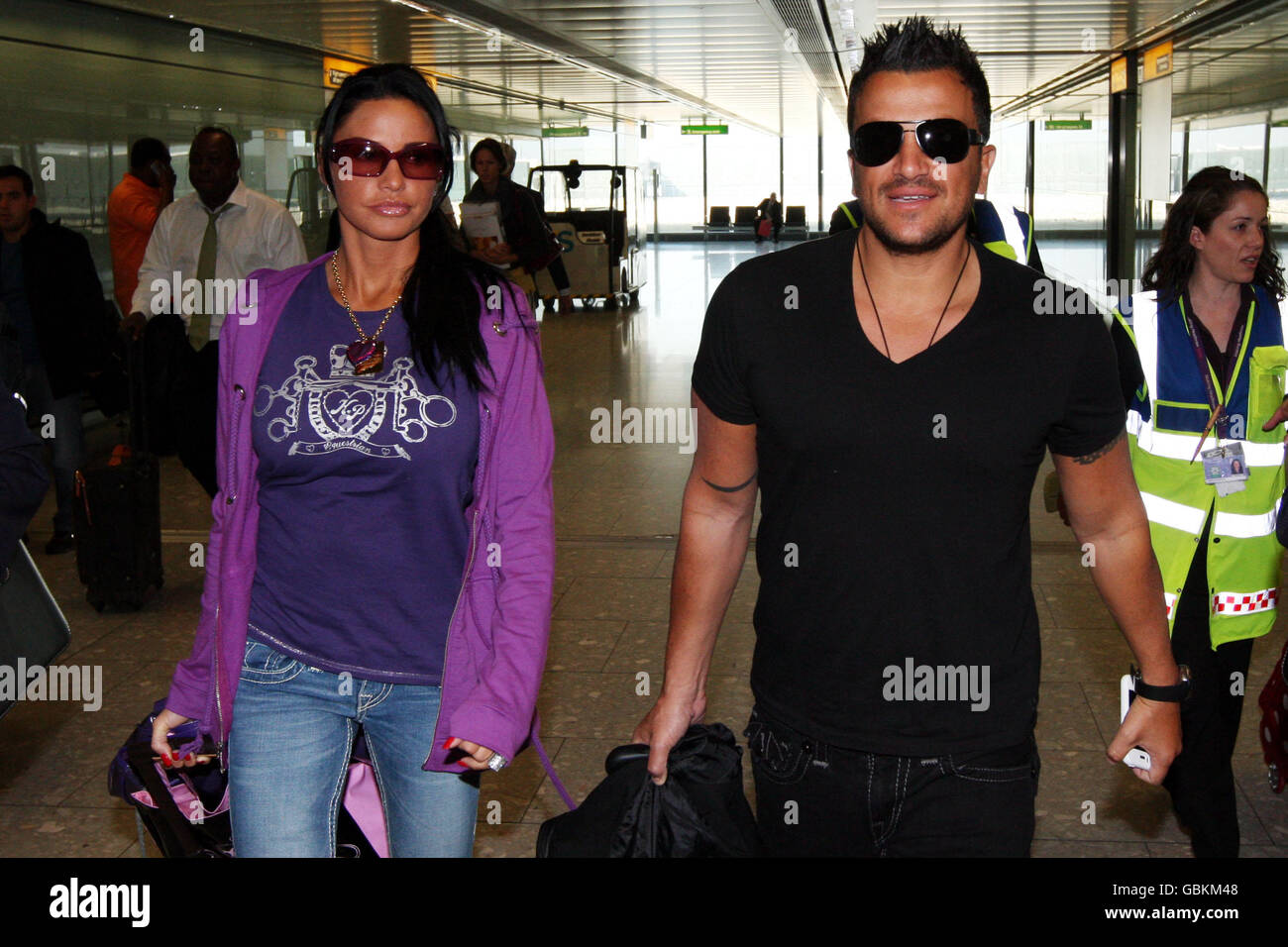 Katie Price and Peter Andre arrive back to terminal 5 at Heathrow